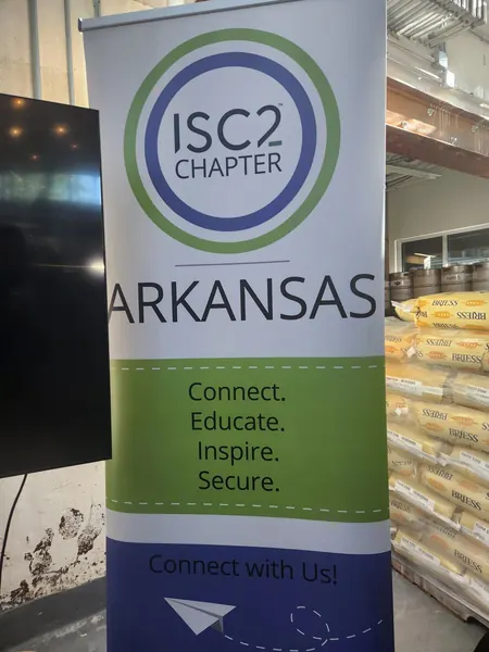 ISC2 Arkansas chapter pull-up banner reading Connect, Educate, Inspire, Secure